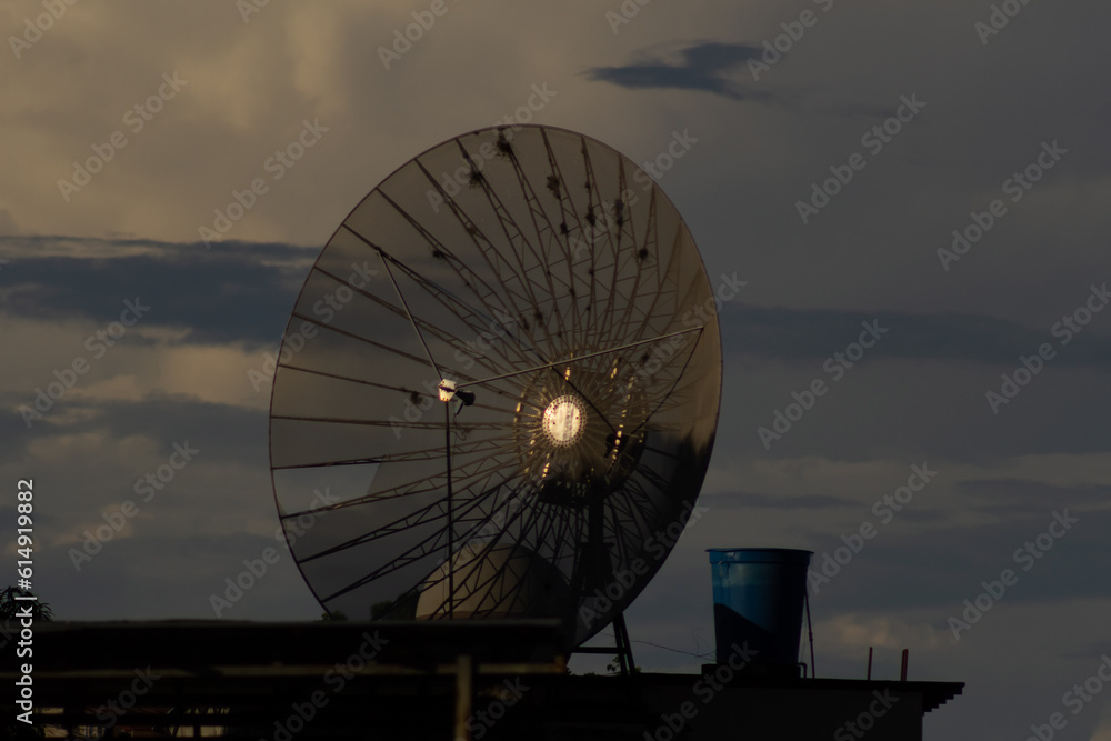 radio telescope at sunset