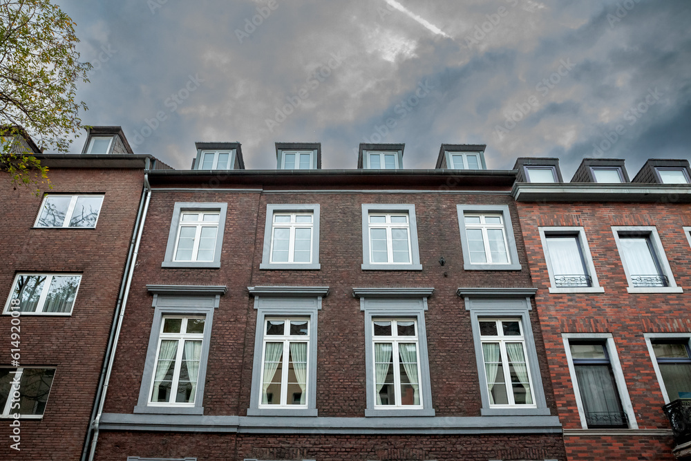 Fototapeta premium Selective blur on typical german vintage facades, in the city center of Aachen, also called altstadt, used for residential purposes, recently renovated with new windows. Aachen is western germany city