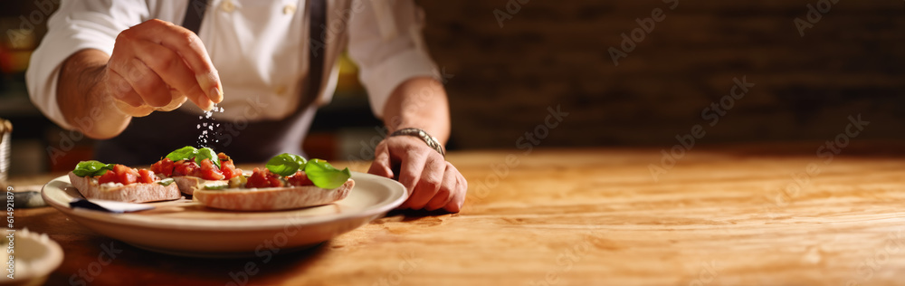 Bruschetta Caprese. Chef seasoning tomato and basil bruschetta with salt on a wooden table with space for text. Copy space. Gastronomy concept. AI Generative 