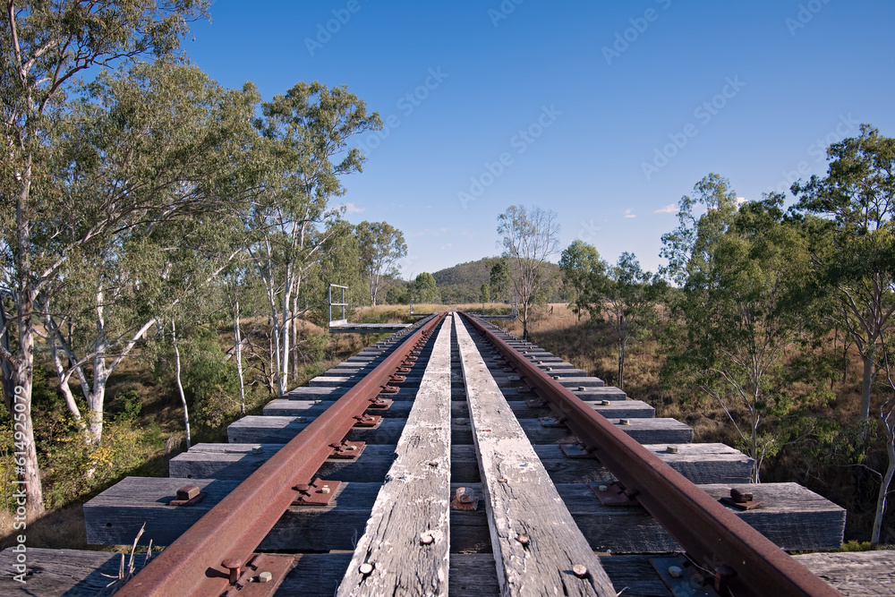 Abandoned railway railbridge through Australian landscape