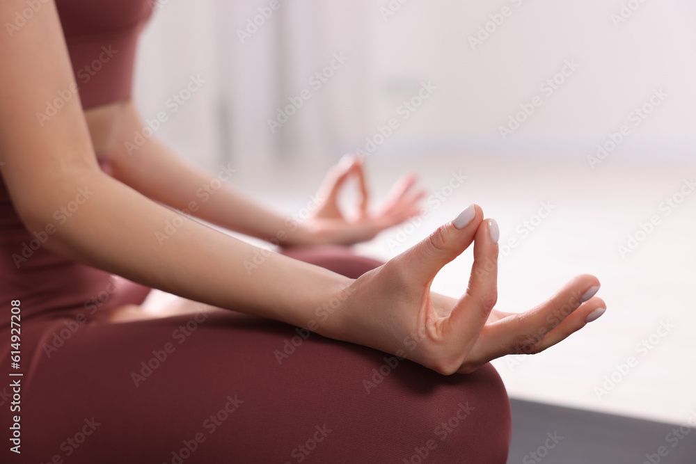 custom made wallpaper toronto digitalWoman in sportswear meditating indoors, closeup view