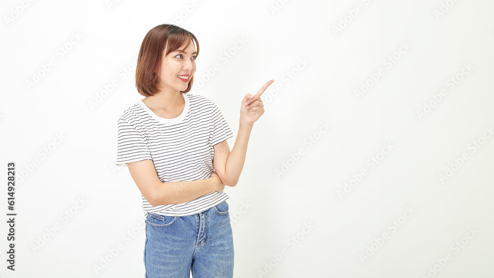 Charming young Asian businesswoman with a short brunette wearing a t-shirt and jeans standing on a white background copy space Charming young Asian businesswoman with a short brunette wearing a t-shirt and jeans standing on a white background copy space