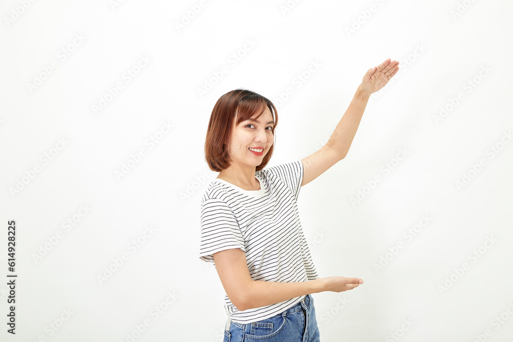 Charming young Asian businesswoman with a short brunette wearing a t-shirt and jeans standing on a white background copy space Charming young Asian businesswoman with a short brunette wearing a t-shirt and jeans standing on a white background copy space