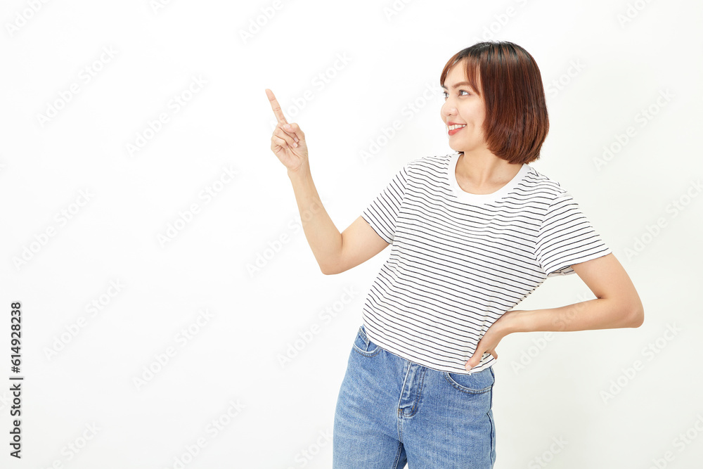 Charming young Asian businesswoman with a short brunette wearing a t-shirt and jeans standing on a white background copy space Charming young Asian businesswoman with a short brunette wearing a t-shirt and jeans standing on a white background copy space