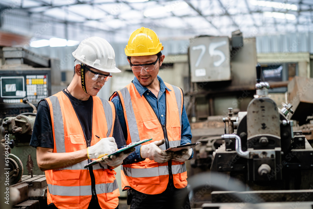 Engineers or Supervisors using a digital tablet and discussing inspection workshops mechanical maintenance in a factory, Working together, Coordination and Teamwork concepts. Engineers or Supervisors using a digital tablet and discussing inspection workshops mechanical maintenance in a factory, Working together, Coordination and Teamwork concepts.
