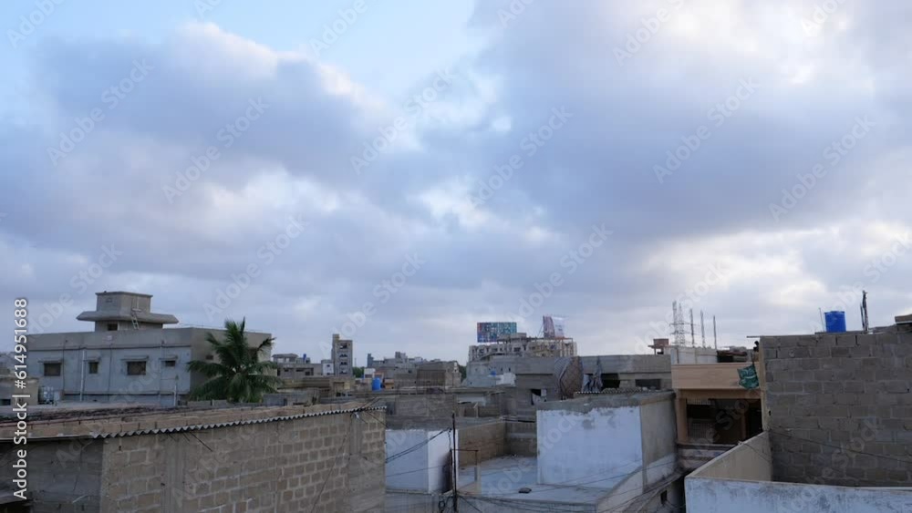 Timelapse shot of cloud movement over buildings in Karachi, Pakistan on a cloudy day. Timelapse shot of cloud movement over buildings in Karachi, Pakistan on a cloudy day.