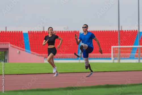 Asian female trainer, male athlete with prosthetics jog together, warming up before speed run at stadium