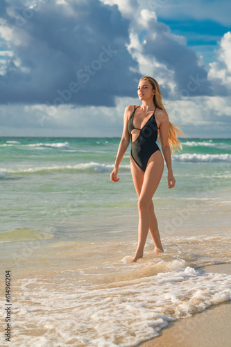 Virginia. Outdoor lifestyle portrait of beautiful young woman on the beach. Natural beauty. Travel and youth. Summer vibes. Freedom and carefree concept. Sexy fashion woman playing on seashore.