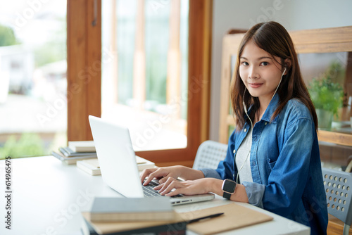 Happy Confident young asian business woman with laptop. business successful technology concept.