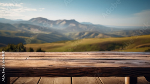 Empty old Wooden table in front of green mountain and blue sky © aiman
