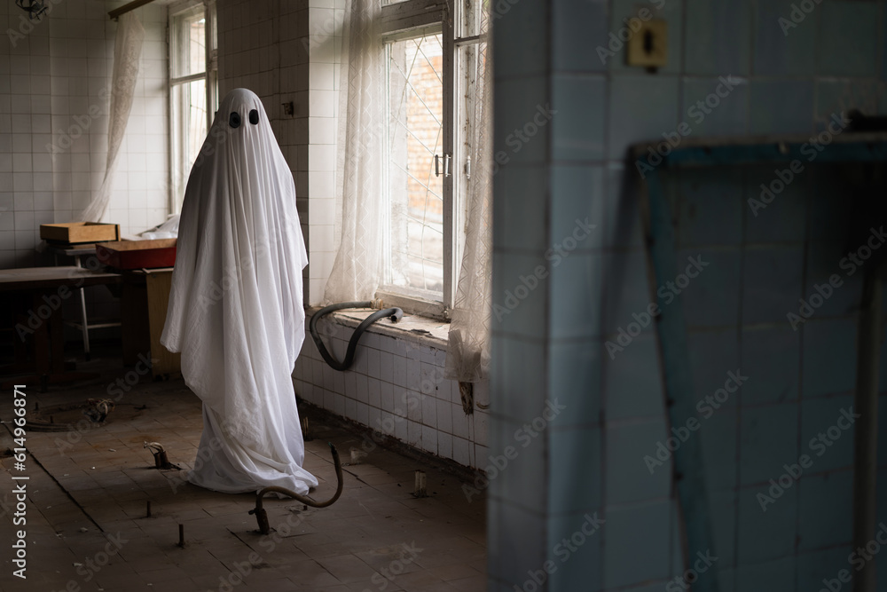 Ghost in white sheet walk in abandoned ruined clinic Ghost in white sheet walk in abandoned ruined clinic