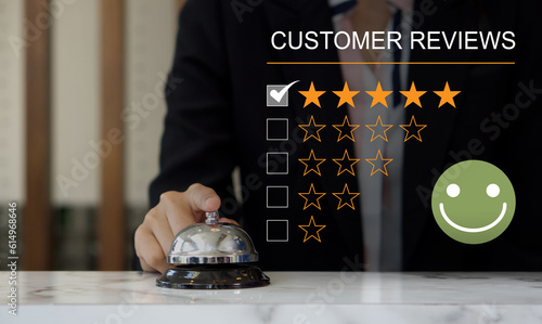 Cuadro en lienzo Customer experience satisfied concept, silver service bell on hotel reception desk with happy emotion face, great review, good service like good quality, high rating, social media very good