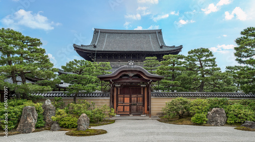 interior garden of the kenninji temple with karesansui style, a stone path and a background of trees. It is a Buddhist temple with more than 800 years