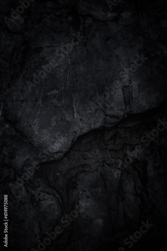 Dark backgrounds of rock texture. Mysterious black abstract background.