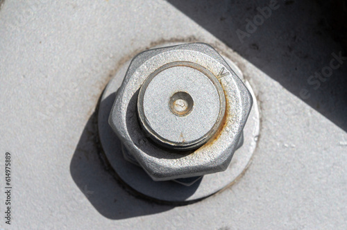 Connection to the foundation of the metal base using large bolts and nuts