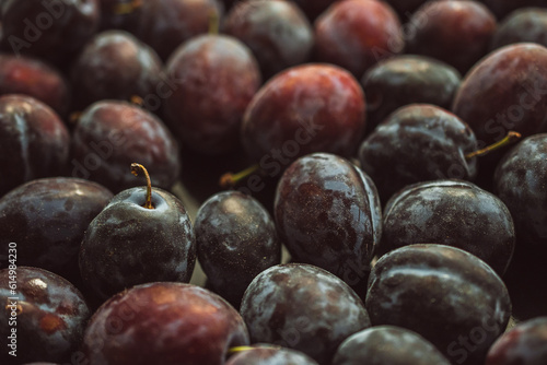 Fresh plums on the table, close-up © Branimir