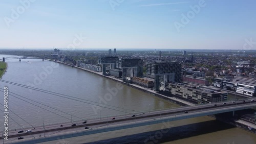 Crane house buildings on Cologne city Riverfront and severin Bridge traffic. Aerial photo