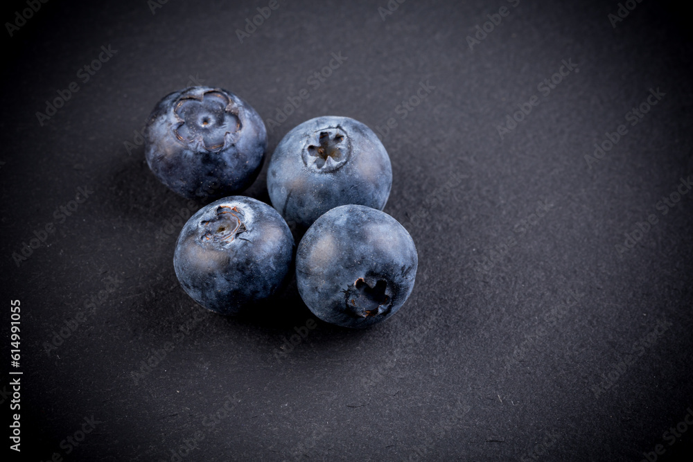 Blueberries on stone plate background Blueberries on stone plate background