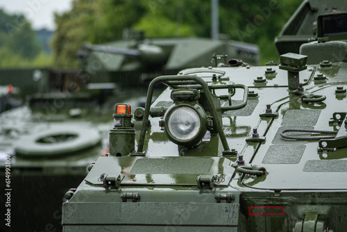 Armoured tanks and military infantry fighting vehicles ready to move under the rain, Lithuanian Land Force, NATO response force