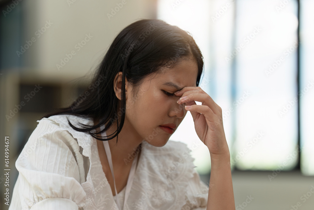 Stressed Financier a asian woman at works, uses a laptop, makes a report to a finance company. Accounting and financial concept Stressed Financier a asian woman at works, uses a laptop, makes a report to a finance company. Accounting and financial concept