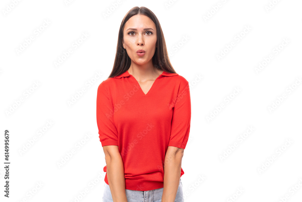 young caucasian brunette in a red short-sleeve shirt sends an air kiss young caucasian brunette in a red short-sleeve shirt sends an air kiss