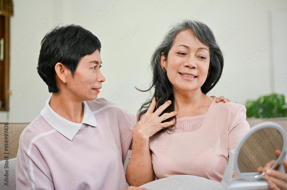 A beautiful middle-aged woman feels happy after getting her makeup and hair done A beautiful middle-aged woman feels happy after getting her makeup and hair done