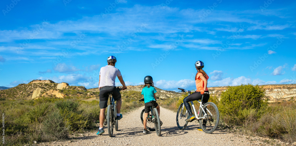 family in bike in countryside family in bike in countryside
