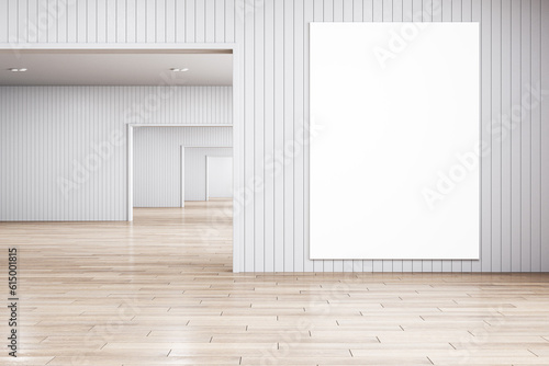 Modern light gallery interior with wooden flooring and empty white mock up frame. Museum and exhibition concept. 3D Rendering.