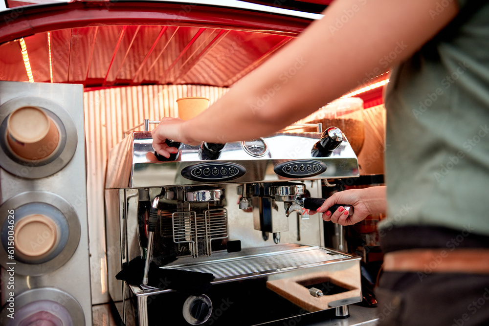 Barista preparing coffee at a mobile cafe Barista preparing coffee at a mobile cafe