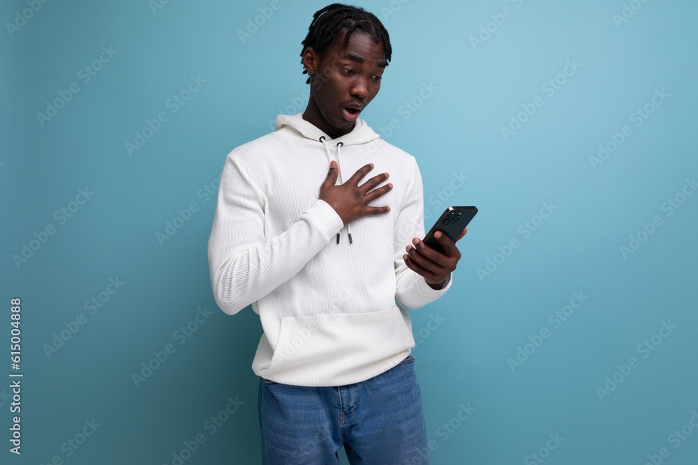 surprised man young brunet american man talking in smartphone surprised man young brunet american man talking in smartphone