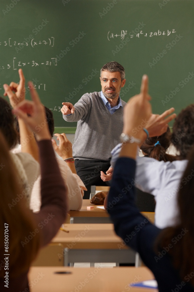 Math teacher giving lessons. Classroom with students. Elementary education