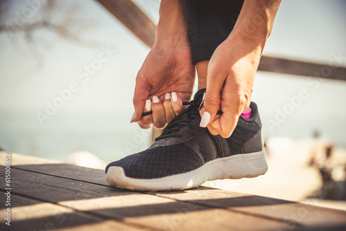 feet running on road closeup on shoe