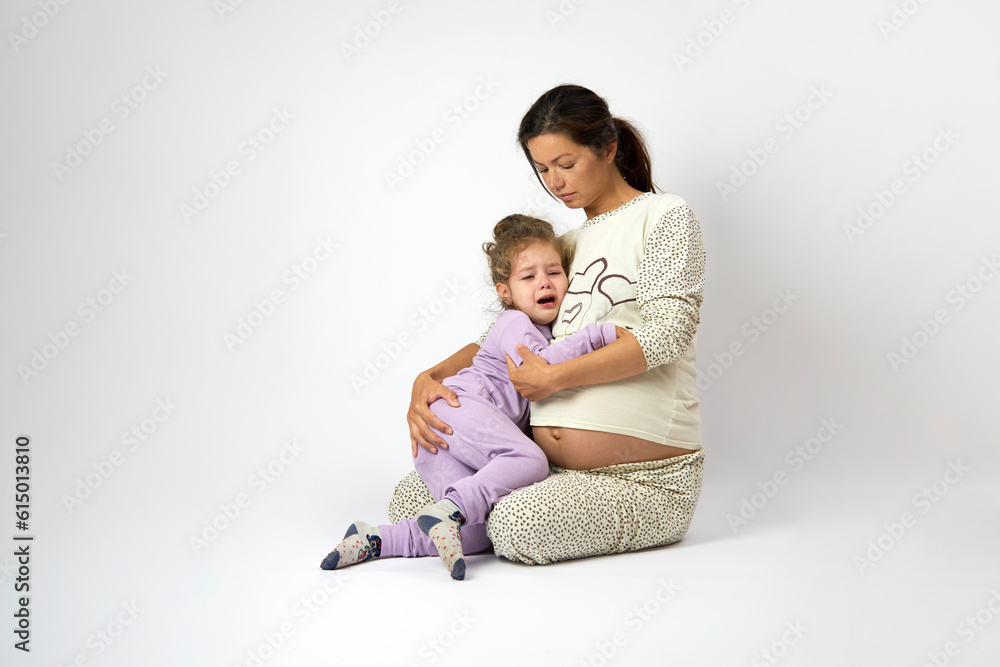 Pregnant mother and daughter are spending time together Pregnant mother and daughter are spending time together