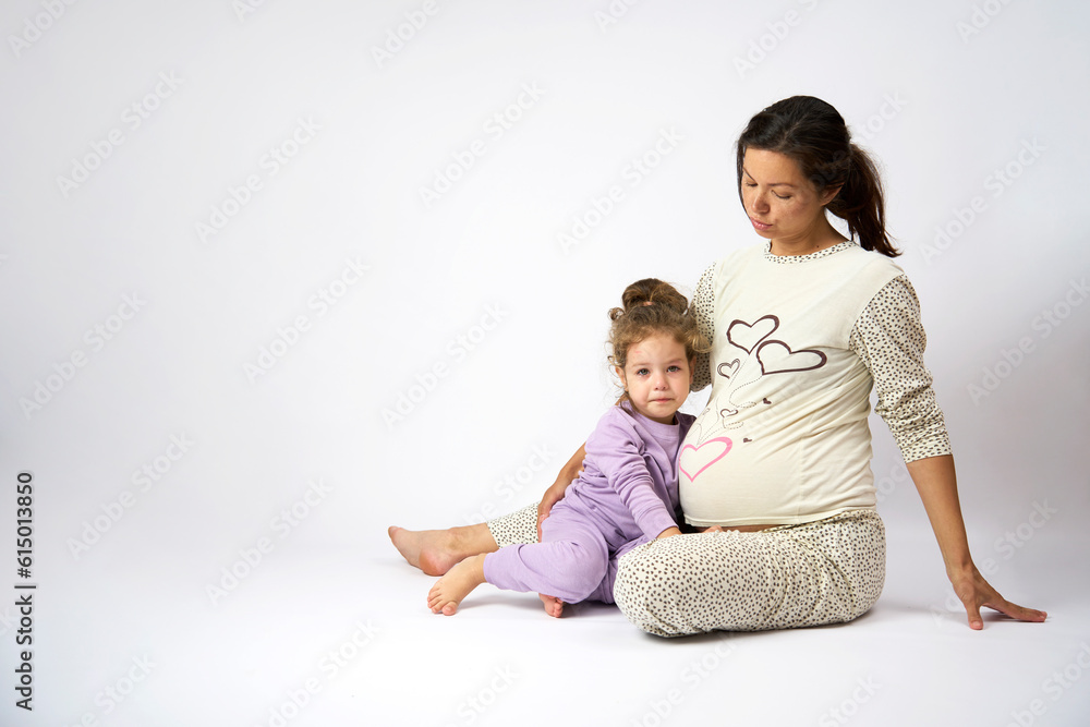 Pregnant mother and daughter are spending time together Pregnant mother and daughter are spending time together