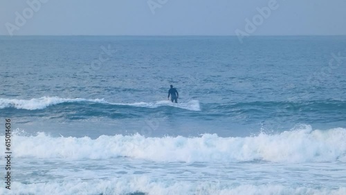 close view of surfer decides to relinquish the opportunity presented by a small wave. photo