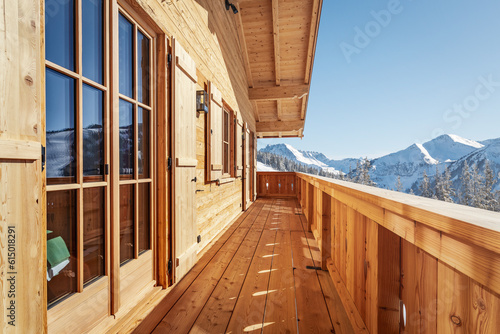 Balcony view from wooden chalet in the alps