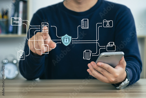 Businessman protecting personal data on smart phone, virtual screen interfaces. cyber security. Cybersecurity and privacy concepts to protect data.