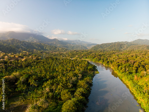 Aerial drone view of the river in the green jungle in Sierra nevada de Santa Marta Tayrona park in colombia  photo