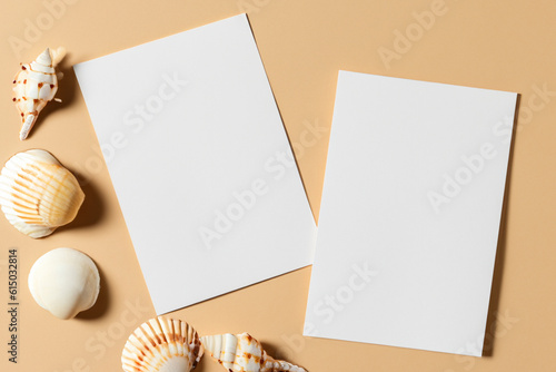 Gently beige background, white paper cards A4, A6, business cards and flyers for the company, beauty industry. Soft background, sea and river shells. Generative AI