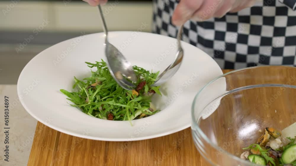 Serving seafood, pear and dried tomatoed salad Serving seafood, pear and dried tomatoed salad