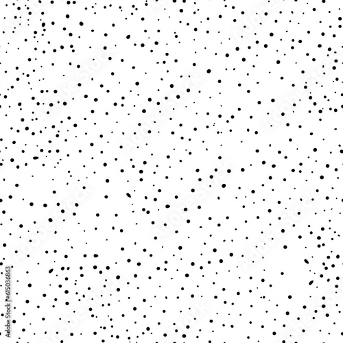 Seamless abstract polka dot pattern. Black hand drawn drip points on white background. Stone terrazzo texture, ink blots stain, grain, paint splash, spray effect. Vector grunge splattered illustration