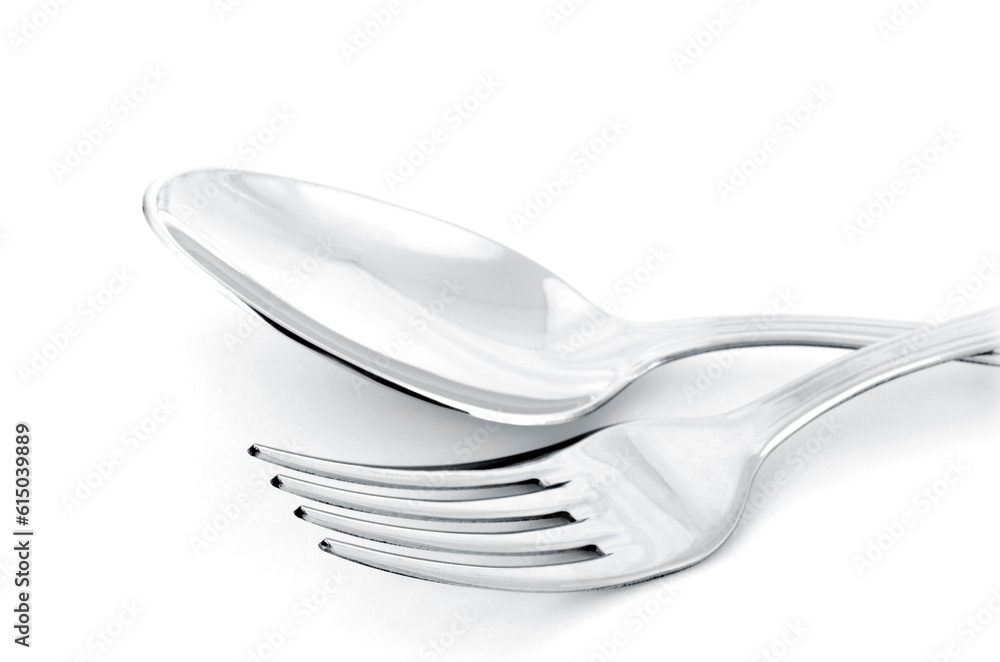 Close up of spoon and fork isolated on white background Close up of spoon and fork isolated on white background