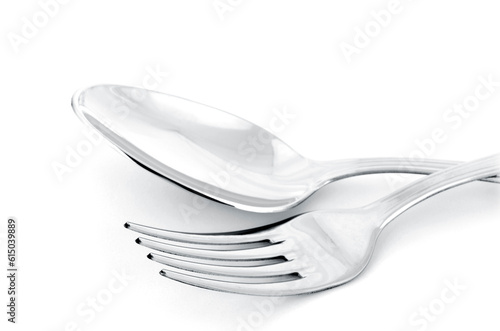 Close up of spoon and fork isolated on white background