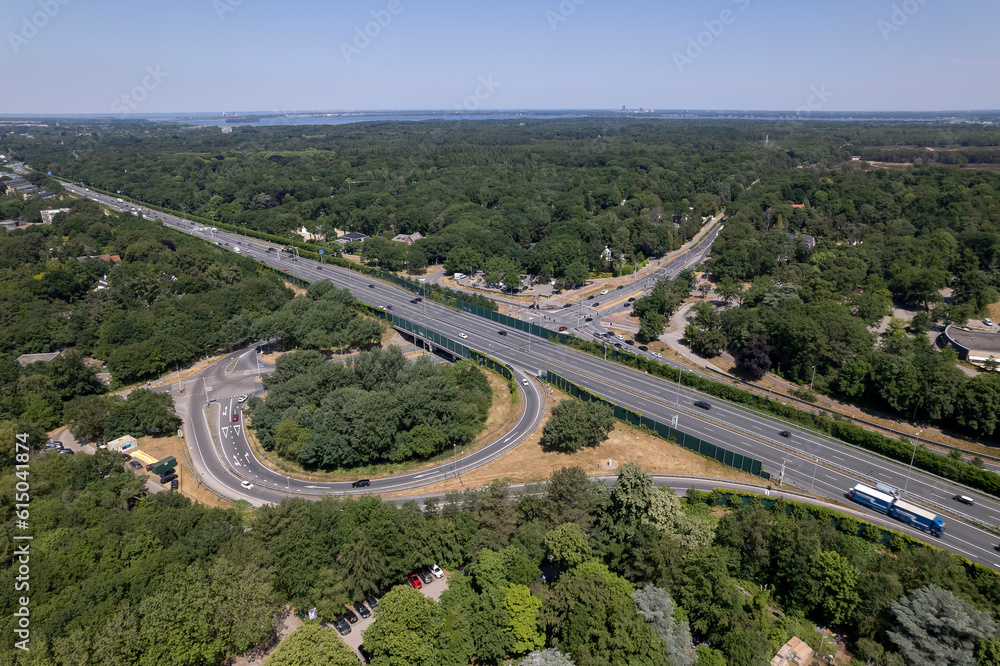 Aerial overview of transit roundabout intersection near Utrecht in Dutch landscape. Infrastructure and urban transportation Aerial overview of transit roundabout intersection near Utrecht in Dutch landscape. Infrastructure and urban transportation