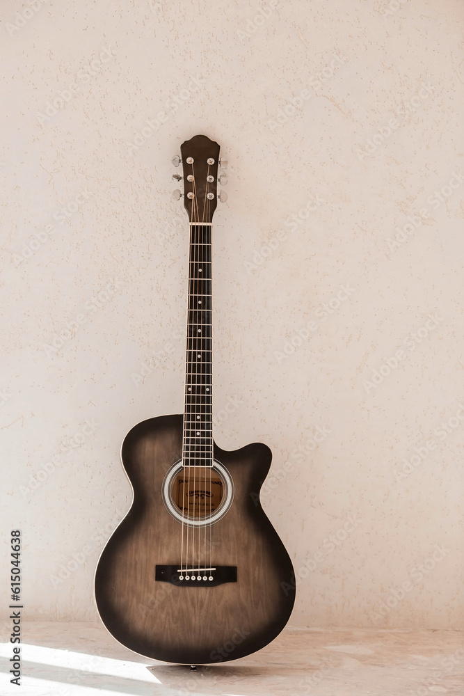 Naklejka premium Guitar. Guitar chords. Acoustic guitar. Music. Musical background. An image of an acoustic guitar. Hard light. Shadows.
