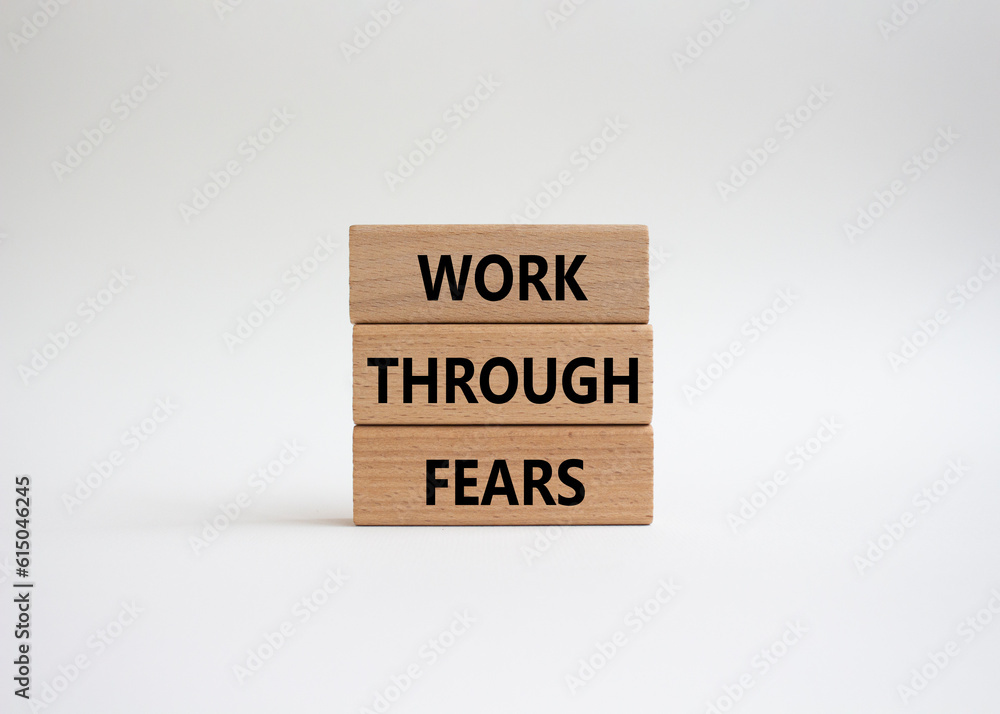 Work through fears symbol. Wooden blocks with words Work through fears. Beautiful white background. Business and Work through fears concept. Copy space. Work through fears symbol. Wooden blocks with words Work through fears. Beautiful white background. Business and Work through fears concept. Copy space.