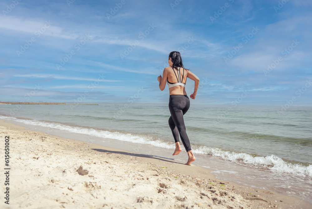 Fitness Girl running on the beach Fitness Girl running on the beach