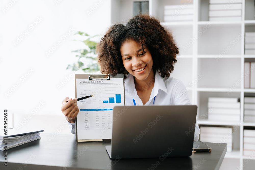 Business woman using tablet and laptop for doing math finance on an office desk, tax, report, accounting, statistics, and analytical research concept in office Business woman using tablet and laptop for doing math finance on an office desk, tax, report, accounting, statistics, and analytical research concept in office