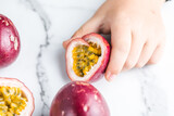 Ripe passion fruit, half and slice of fruit on a white  background.
