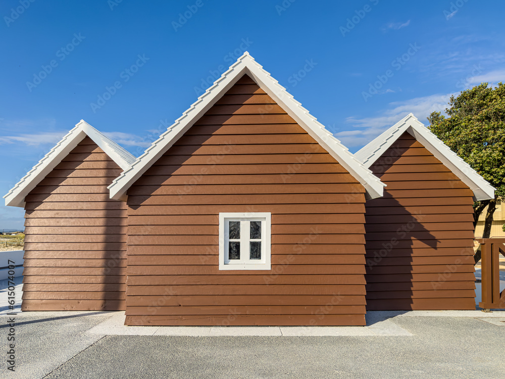 Picturesque view of modern wooden house near the sea on sunny day. Esmoriz, Ovar, Aveiro, Portugal Picturesque view of modern wooden house near the sea on sunny day. Esmoriz, Ovar, Aveiro, Portugal